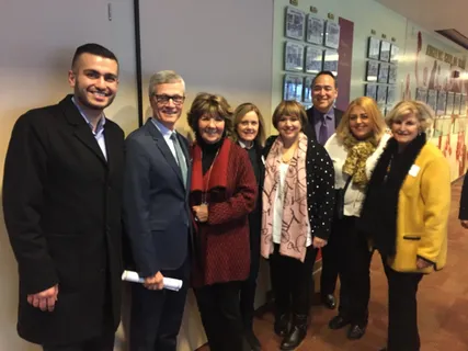 Melina Sardar with community members at a recognition event