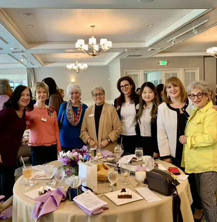 Melina Sardar with guests at a community luncheon