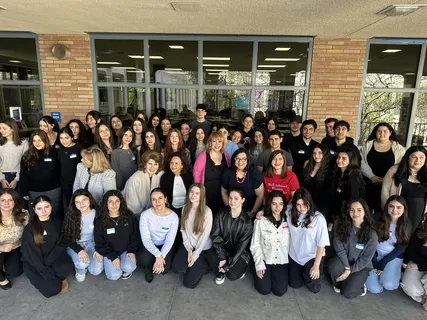 Melina Sardar with a large group of students